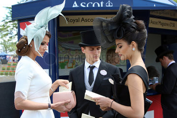 Royal Ascot  Fashion  women with hat and man with top hat at the racecourse