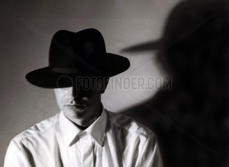 man with hat and his shadow