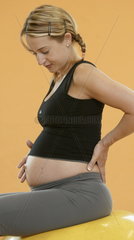 Schwangere Fitnesstrainerin