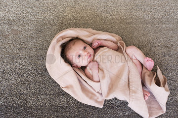 New born baby wrapped in towel