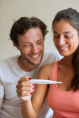 Couple pleased with pregnancy test results