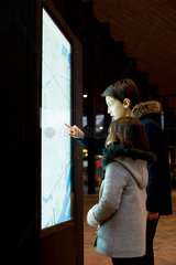 Children consulting illuminated map