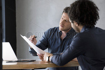 Man listening while document explained