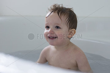 Little boy taking bath