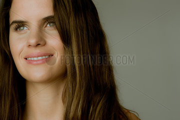 Young woman looking away and smiling  portrait