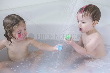 Children playing in bathtub