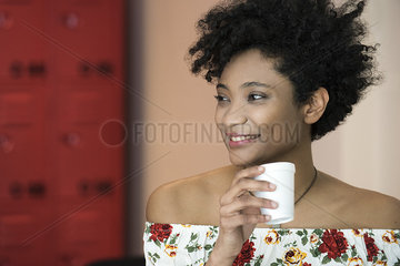 Woman drinking from disposable cup