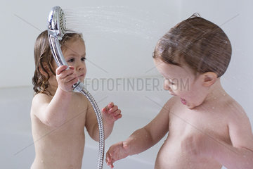 Children playing in bathtub