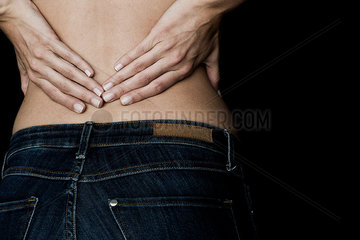 Woman experiencing lower back pain  cropped