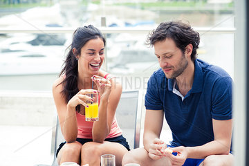 Couple having breakfast together outdoors
