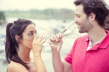 Man and woman drinking champagne together