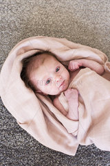 New born baby wrapped in towel