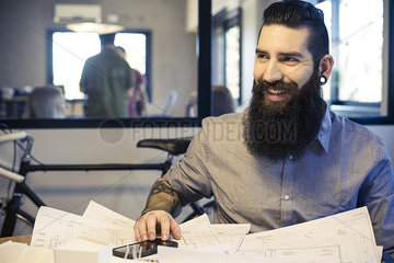 Architect smiling in office