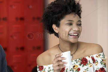 Young woman taking coffee break