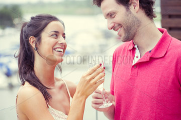 Man and woman clinking glasses of champagne