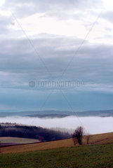 Landschaft im Schwarzwald mit Bodennebel und Wolken  Hoechenschwand  Deutschland