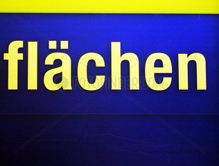 Das Wort FLAECHEN in gelben Buchstaben auf blauem Grund