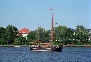 Rostock  ein kleines Boot faehrt zur Hanse Sail 2004 ein