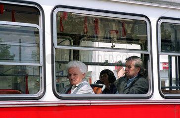 Wien  Oesterreich  Seniorin in einer Strassenbahn
