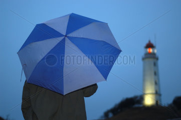 Regenschirm und Leuchtturm