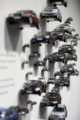 Berlin  Deutschland  verschiedene Mercedes-Benz Modellautos an einer Wand