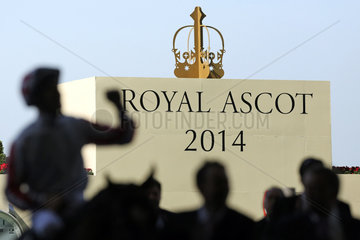 Royal Ascot  Silhouetted jockey in front of the shield Royal Ascot 2014