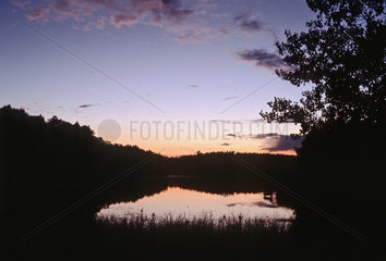 Sonnenuntergang an einem See bei Walcz  Polen