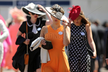 Royal Ascot  Fashion on Ladies Day  women with hats at the racecourse