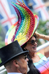 Royal Ascot  Fashion on Ladies Day  woman with hat and man with top hat at the racecourse