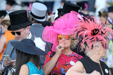 Royal Ascot  Fashion  women with hats and men with top hats at the racecourse