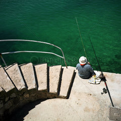 Angler im Hafen von Fornells  Menorca
