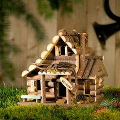 Miniatur von einem Holzhaus