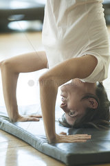 Woman doing a headstand