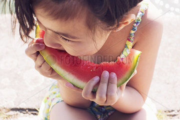 Girl eating watermelon  close-up
