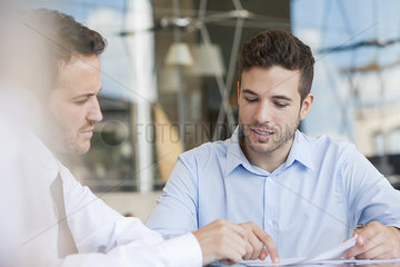 Insurance agent explaining contact to client