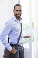 Man smiling as he leaves for work in the morning