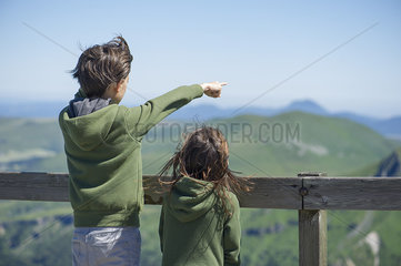 Children looking at mountain view