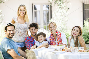 Friends enjoying meal together outdoors