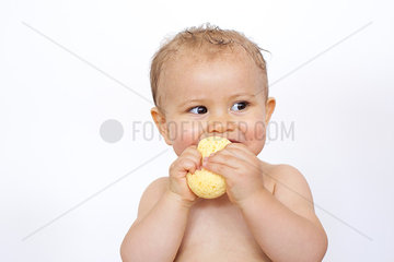 Baby chewing on sponge