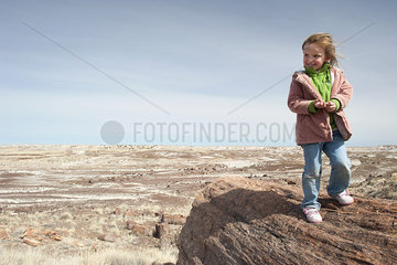 Girl visiting Petrified National Forest in Arizona  USA