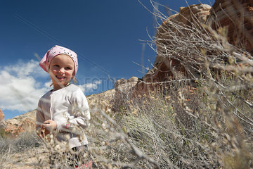 Little girl hiking in nature