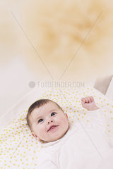 Baby lying in crib