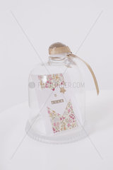 Decorative card in glass jar