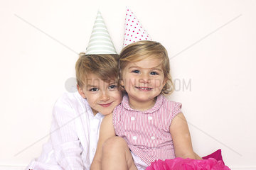 Children wearing party hats  portrait