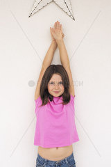 Girl with arms raised in the air  portrait