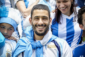 Argentinian football fan smiling at match  portrait