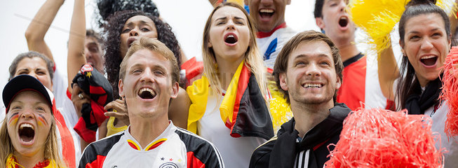 German football fans cheering at football match