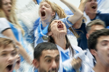 Argentinian football fans shouting while watching football match