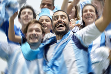 Argentinian football fans cheering at match