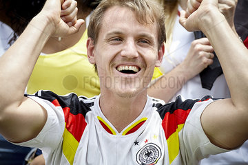 German football fan cheering at match